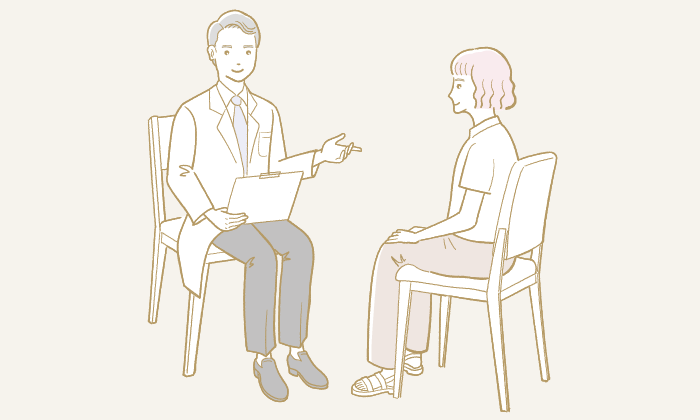 カウンセリングする男性医師